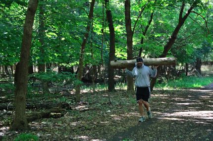 Jogger carrying a long on Des Plaines River Trail